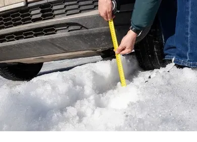 A visual showing the increased ground clearance of a silver Prius equipped with a Prius Offroad lift kit.